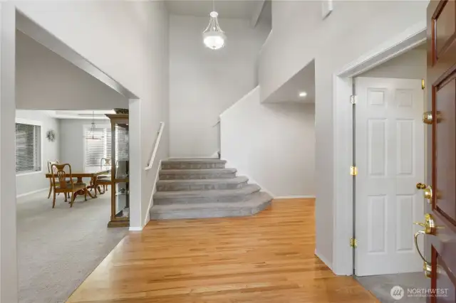 A grand staircase welcomes you to the upper level of the home.
