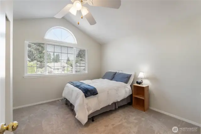 One of two spacious guest bedrooms on upper level.