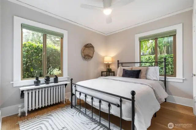 The quiet, corner bedroom overlooks greenery, and is complete with a convenient W/D.