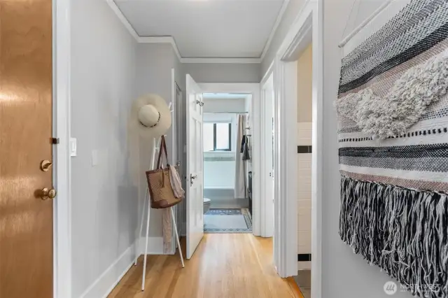 The back door leads to storage & bike rooms, laundry, gardens, carport & the community private patio.