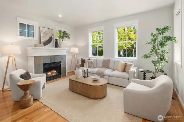Sun drenched family room off the entry with gas fireplace.