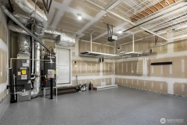 Garage is located directly off the kitchen.  Easy access with groceries etc.  Overhead storage and new epoxy floor.
