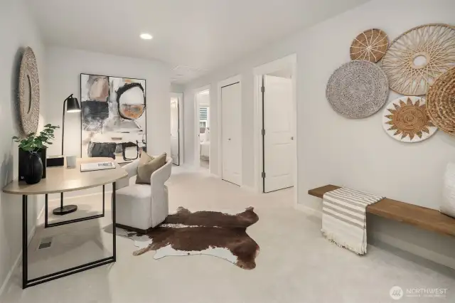 Landing at the top of the stairs.  Perfect spot for an office/homework area or reading nook.