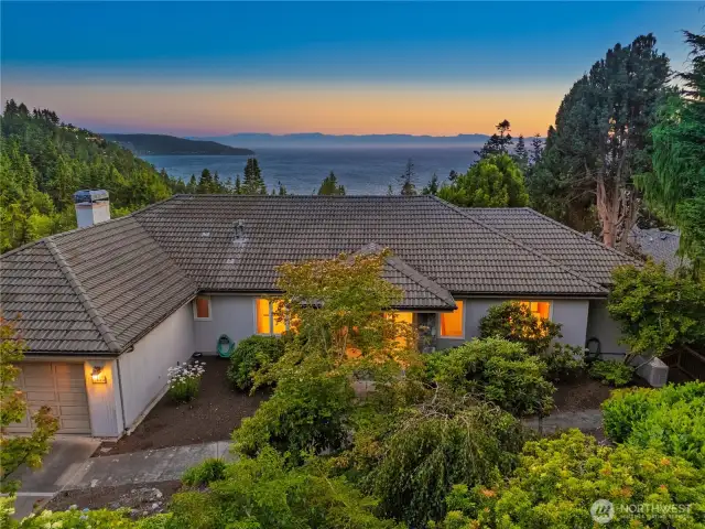 Surrounded by nature with views of the sound.