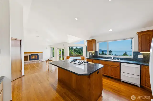 Large kitchen with granite countertops.