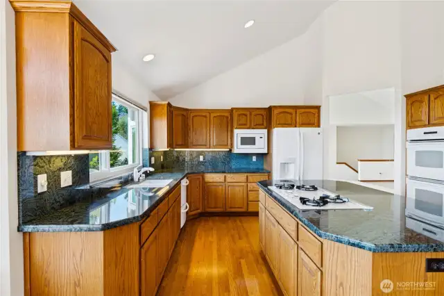 Spacious kitchen with island and newer appliances.