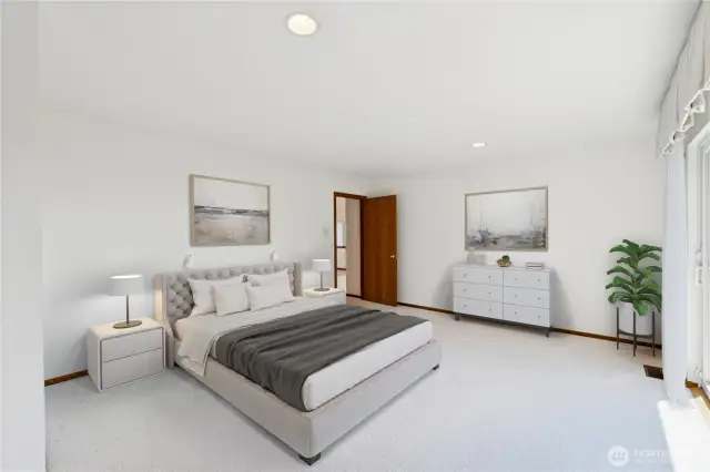 Large primary bedroom for easy main-level living.  Virtually staged.
