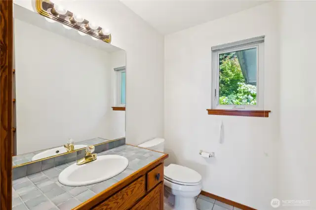 Half bath conveniently located off the kitchen on the main level.