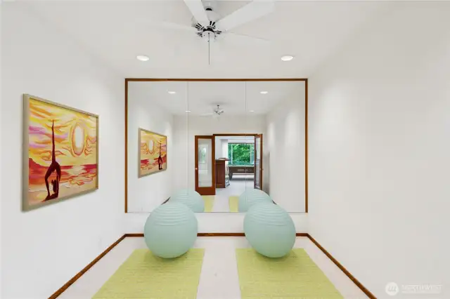 Mirrored room for exercise or yoga.  Virtually staged.