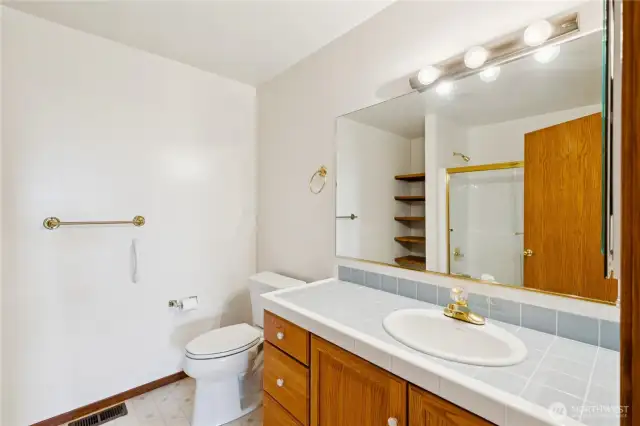 Bathroom 1 on lower level with tub-shower combination.