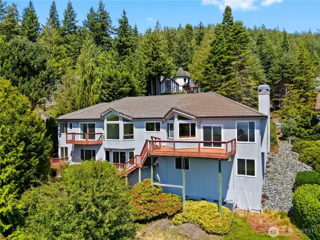 Cedar siding and tile roof.