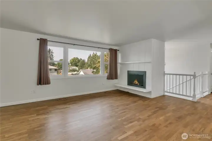 Real hardwood floors and a wood burning fireplace
