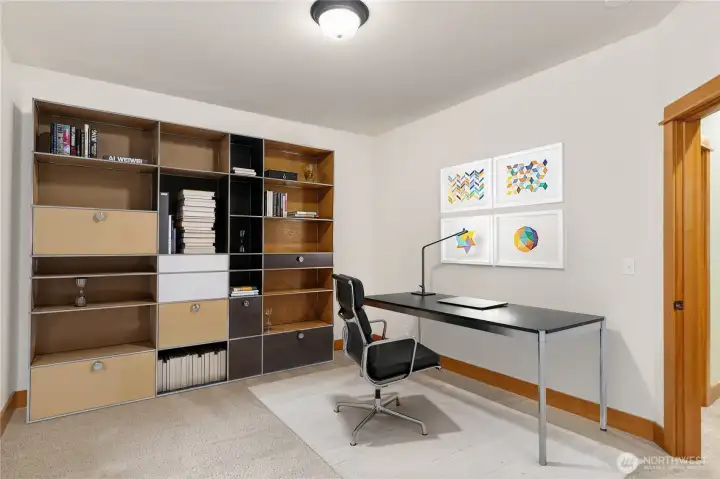 Third bedroom virtually staged as an office.