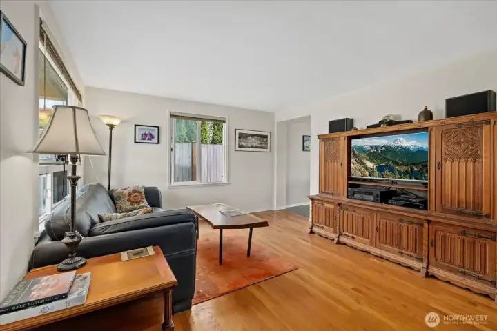 Light-filled living room with hardwood floors