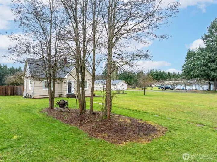 Looking from the front, southeast, corner of the yard. This south facing home is full of natural light!