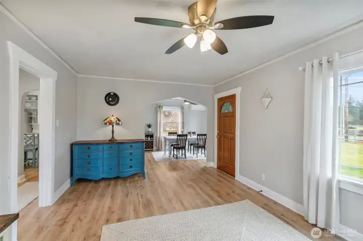 ... And the living room is to the left. Note the updated flooring throughout the home!