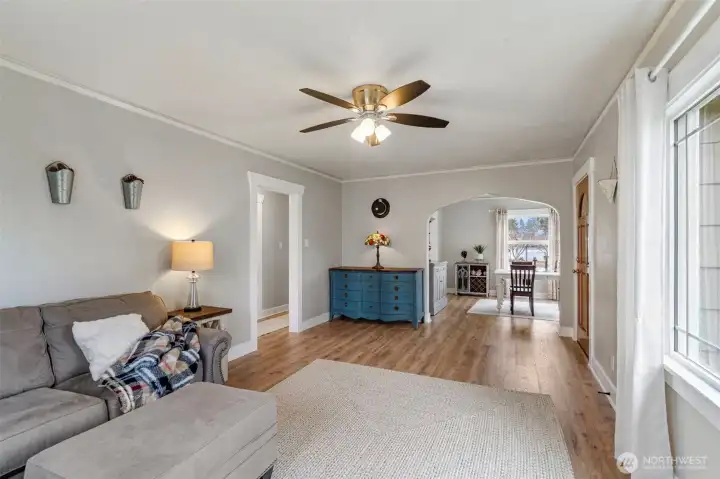 The living room is quite spacious! Somewhere in the home's history, a wood(?) stove sat where the blue dresser now lives.