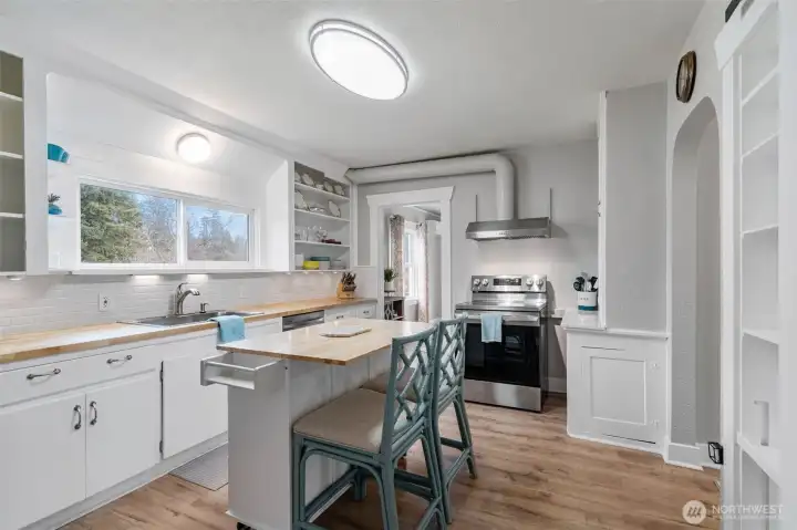Retaining it's original charm, the kitchen is efficient! Counters were recently replaced as was the backsplash. All appliances are also new(er) and remain with the home.