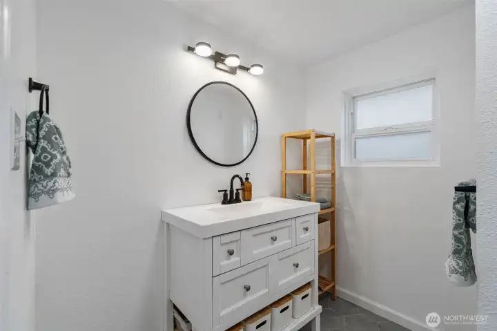 Charming bath with plenty of storage.