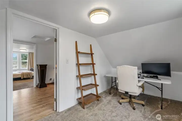 The smaller bedroom upstairs is currently used as a second office space.