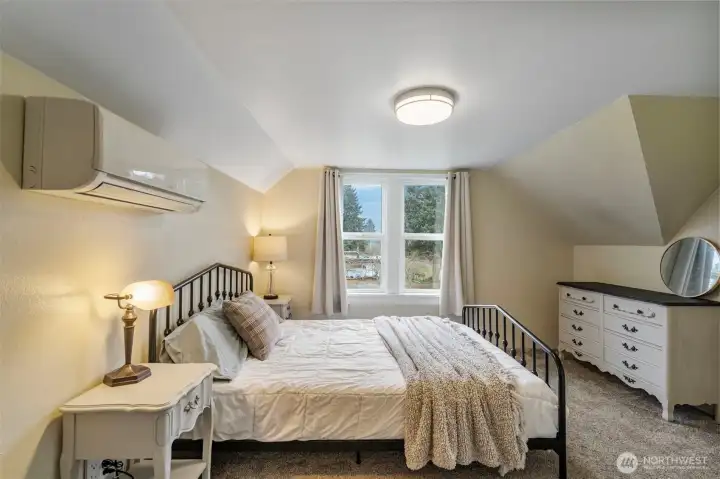 The primary bedroom at the opposite side of the loft is quite spacious and bright!