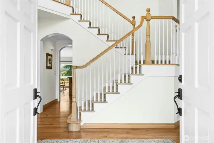 Gracious, grand and gorgeous! These stairs in a cathedral ceilinged entry will literally sweep you away.