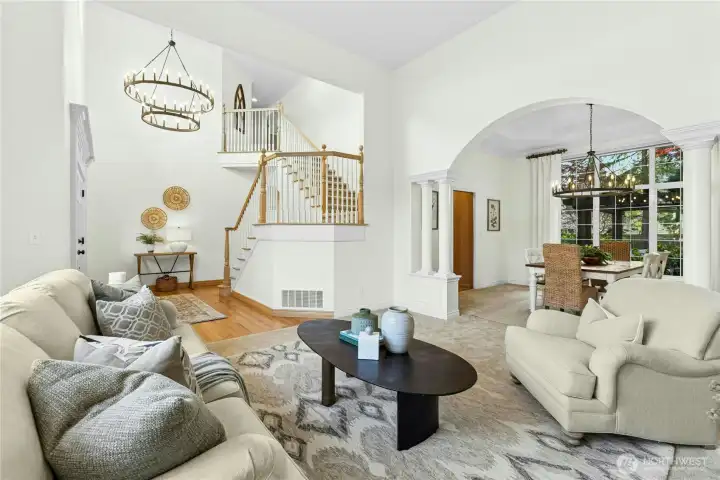 For perspective - check out the stately chandeliered entry, grand living room, and large dining room seen here through the arched passage.