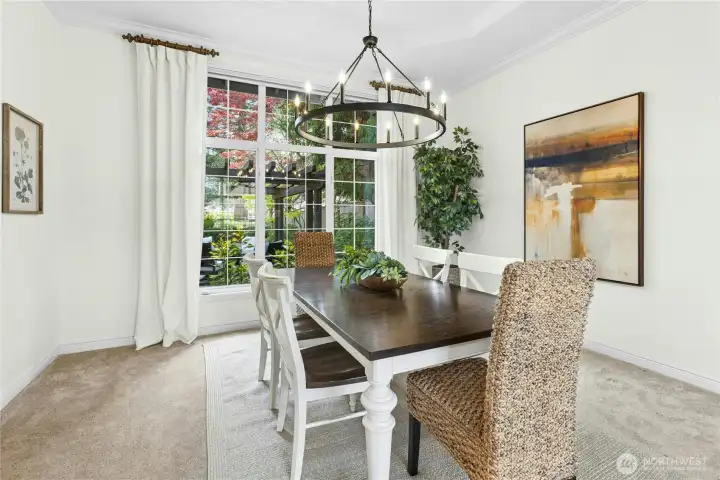Your first glimpse of the heavenly backyard can be enjoyed through these dining room windows. Only a hint of what is to come!