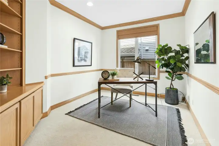 Still on the main floor, this office / den is functional perfection! Built ins provide plenty of storage.