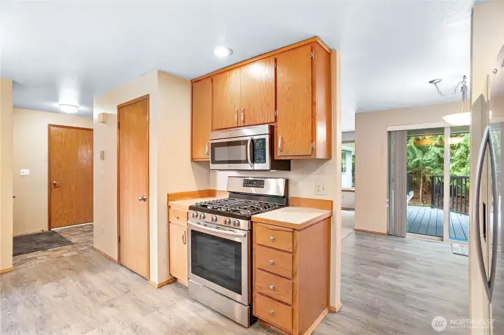 Kitchen looking toward dining room and slider to new Trex deck