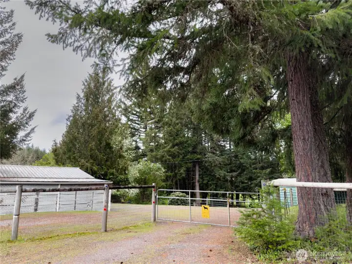 Gated Driveway entrance plus entire 2.65 Acres property is fenced with 5 foot "no climb" fencing