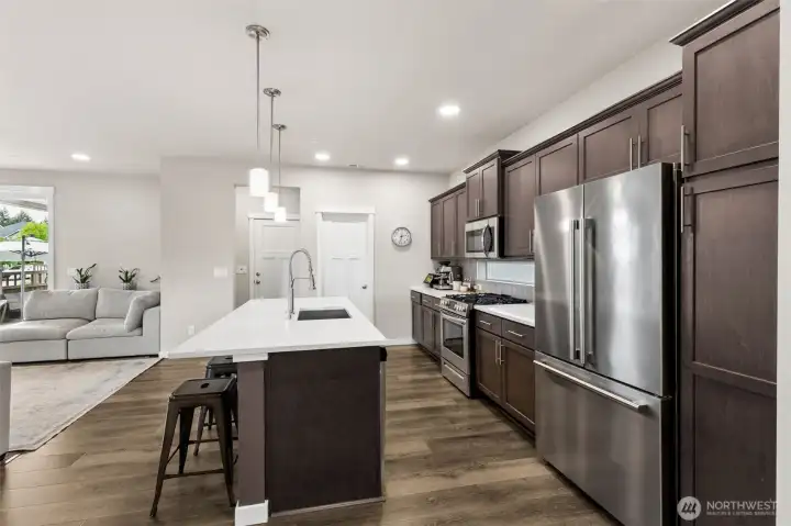 Stainless appliances and lots of cabinet space. Mudroom off garage.