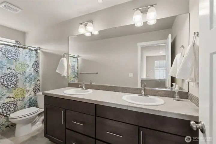 Hall bath with double vanities.
