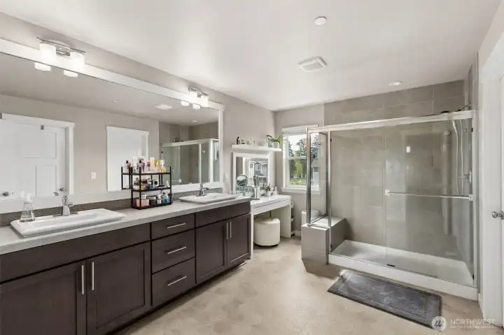 Primary bath with oversized shower and walk in closet.