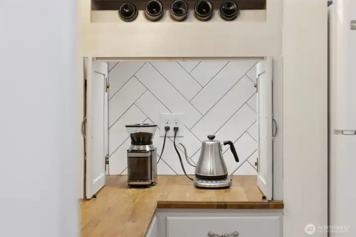 Thoughtfully built in, this enclosable space keeps everything neat and tidy.