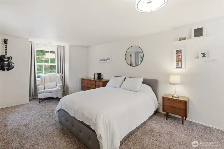 Entry into the massive primary bedroom. Notice the reading nook in the back ready for relaxation.
