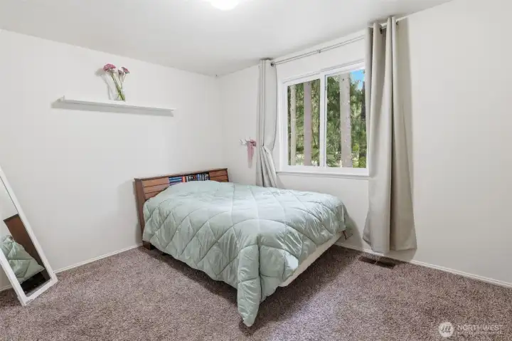 Guest bedroom 2 also overlooks the backyard and enjoys a great layout.
