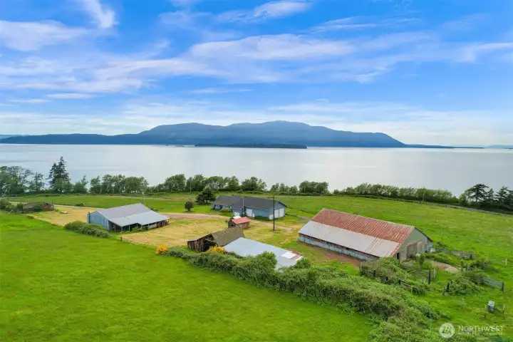 Coastal farmstead setting with open space, outbuildings, and incredible views. Coastal farmstead setting with open space, outbuildings, and incredible views.