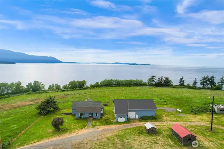 Water-facing home and grounds positioned to capture the surrounding natural beauty. Water-facing home and grounds positioned to capture the surrounding natural beauty.
