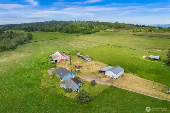 Wide-open acreage with a mix of pasture, mature trees, and coastal surroundings. Wide-open acreage with a mix of pasture, mature trees, and coastal surroundings.