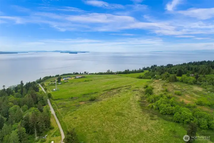 Elevated aerial view highlighting the property’s scale, shoreline access, and surrounding natural beauty. Elevated aerial view highlighting the property’s scale, shoreline access, and surrounding natural beauty.
