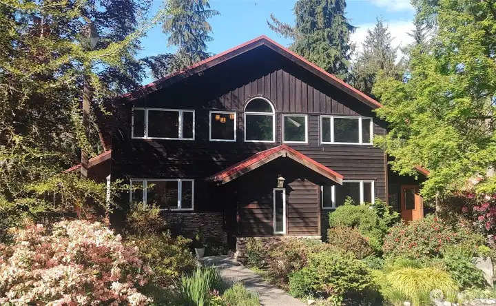 Amazing Timber Frame home sits among the beautifully landscaped property.