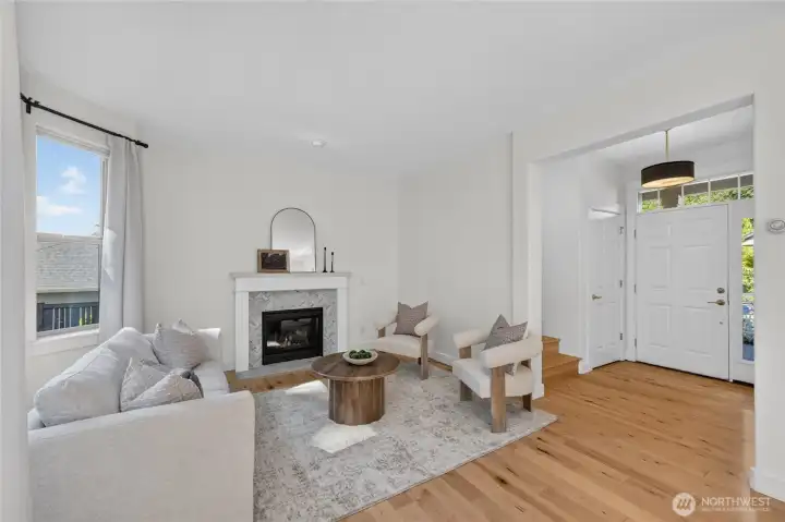 A view of the living room with front entry.