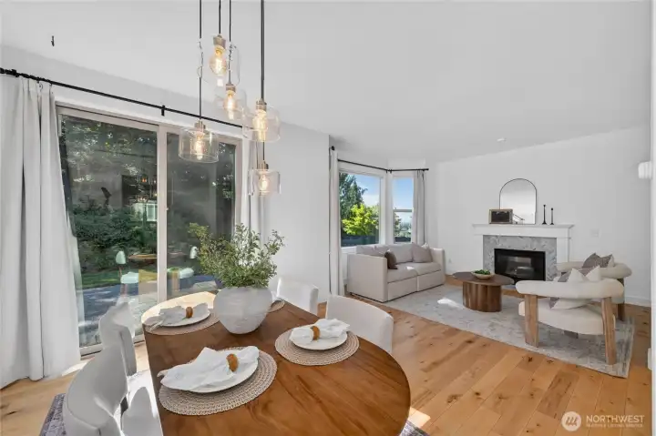 The formal dining room and living room overlook the beautiful backyard with easy access to the back patio.