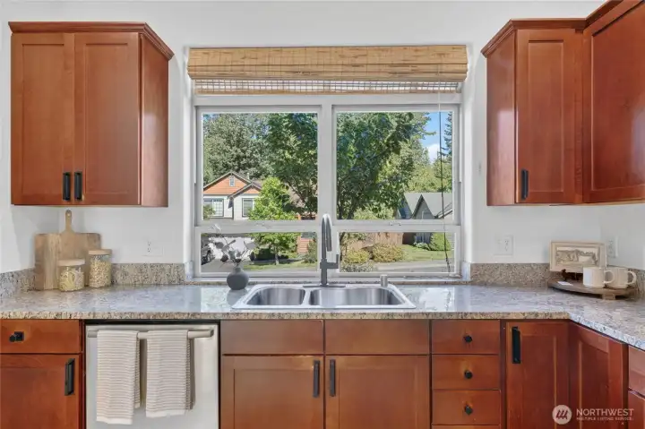 The kitchen faces the front of the home so easy to see your guests coming and going.