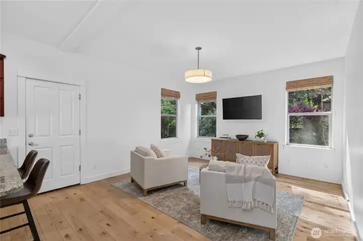 Directly adjacent to the kitchen is a cozy family room. Lots of windows to let light in.