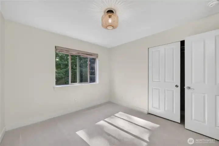 The second upstairs bedroom overlooks the back of the home.