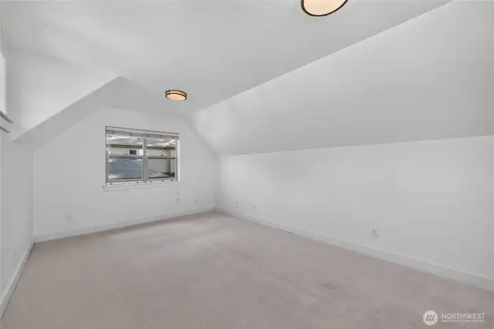 At the end of the upstairs hallway is a large bonus room with closet.