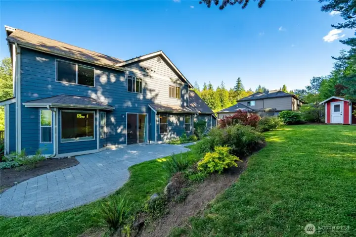 Outside you'll find a large concrete patio and terraced backyard.