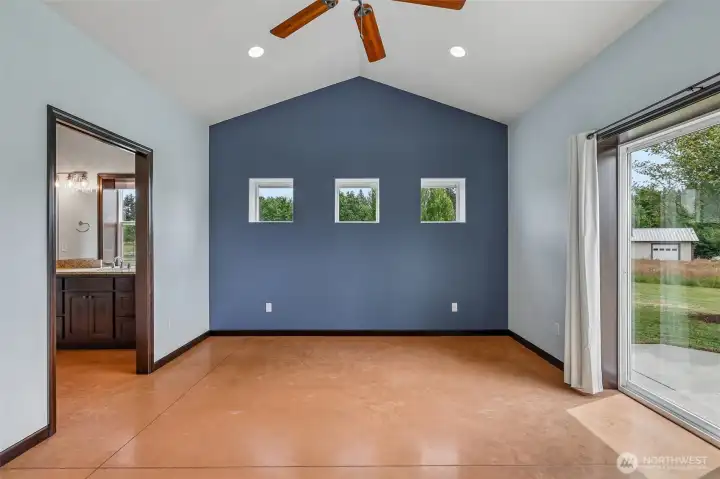 Primary Bedroom w/ access to back patio.